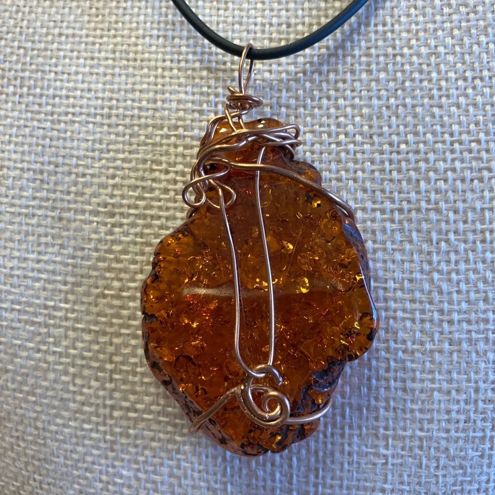 WIRE WRAPPED PENDANT WITH Copper wire on a black cord